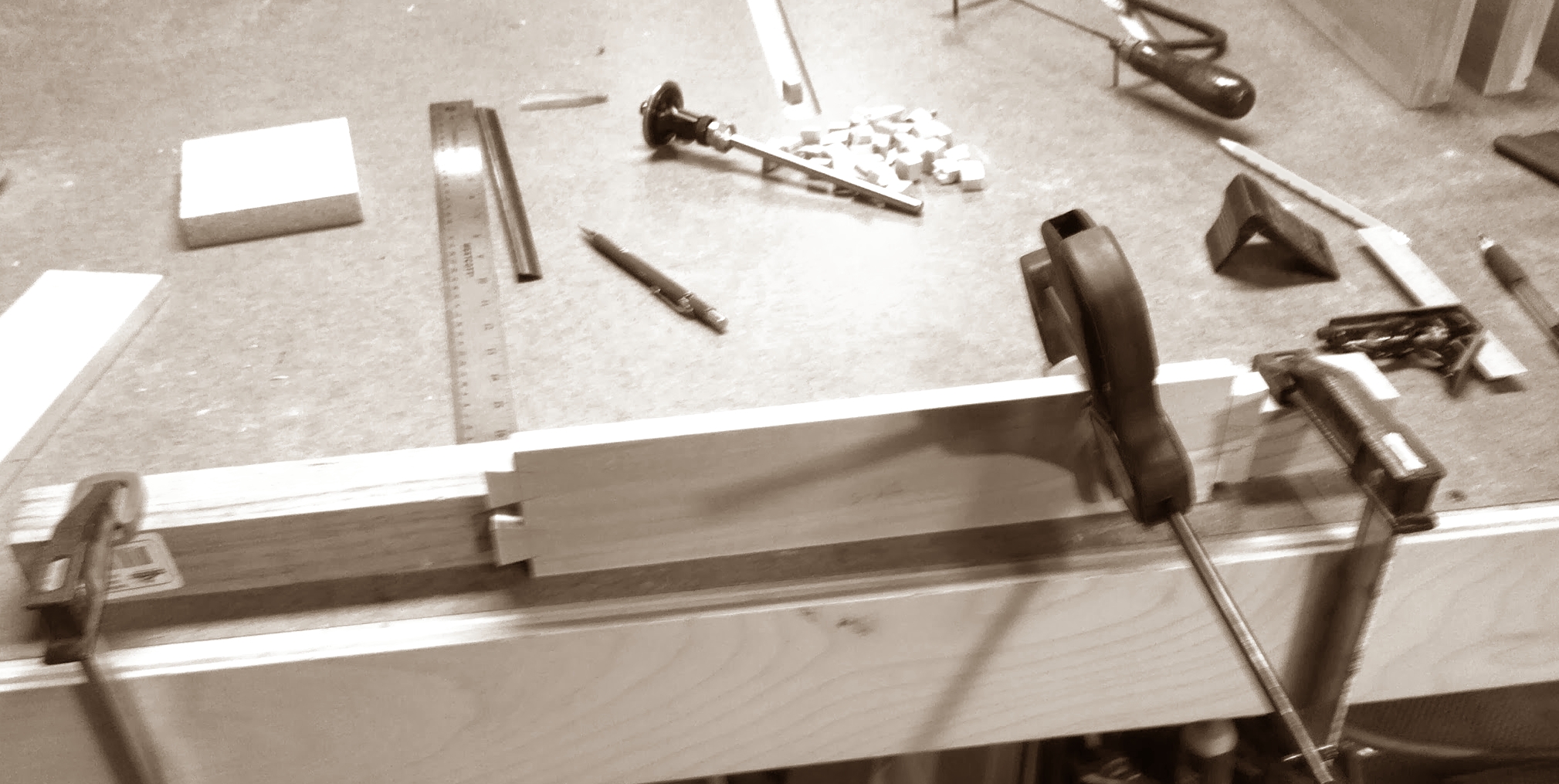 Jury-rigged bracket to hold drawer sides while cutting sides
