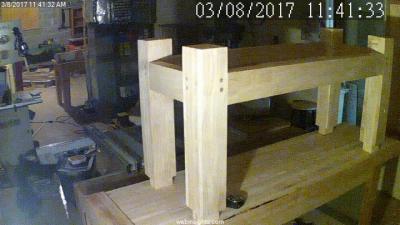 Webcam shot of the glued and pinned undercarriage of the bench, perched atop the benchtop